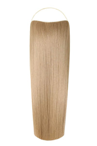 Woman wearing sleek straight Syn Halo hair extensions styled naturally