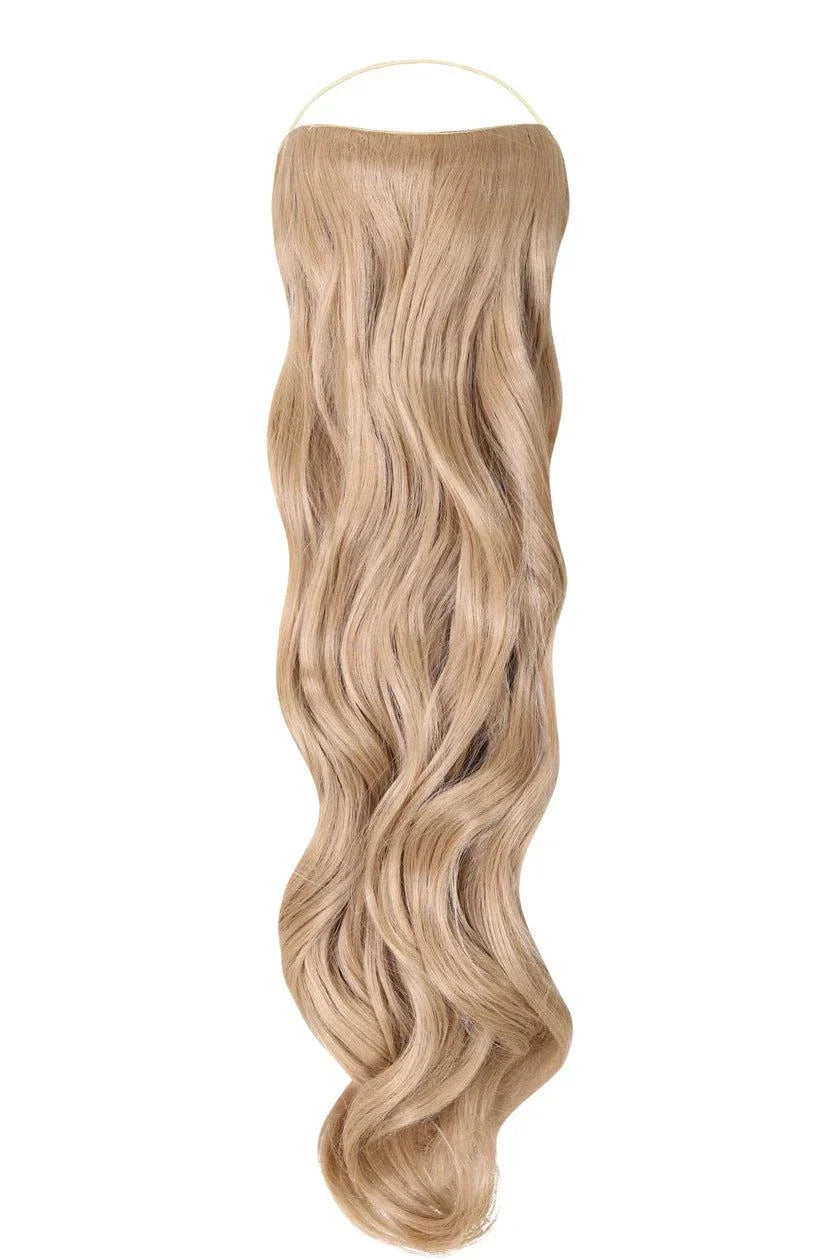 Curly Syn Halo hair extensions with bouncy volume and natural look on a model with long curly hair
