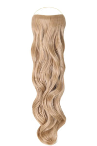 Curly Syn Halo hair extensions with bouncy volume and natural look on a model with long curly hair