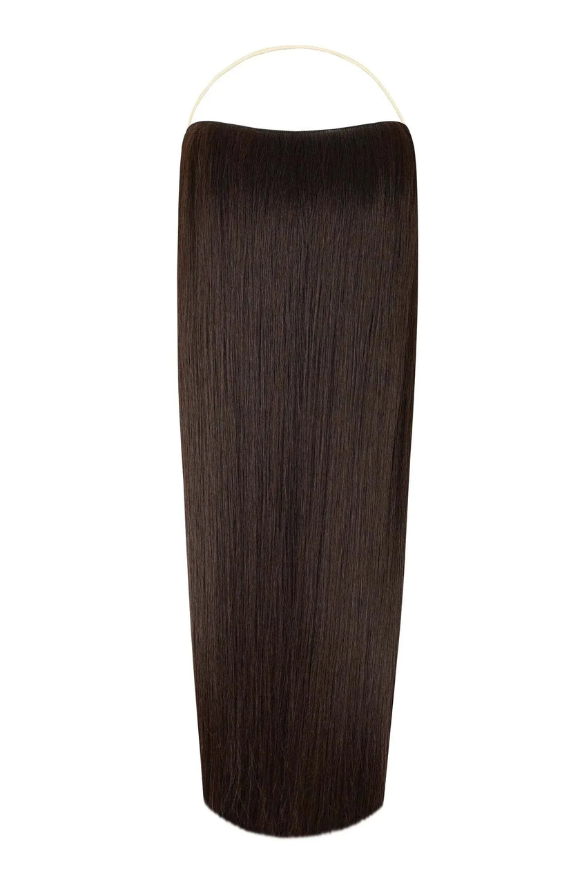 Woman wearing straight syn halo hair extensions with natural, voluminous look and seamless blend