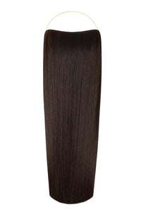 Woman wearing straight syn halo hair extensions with natural, voluminous look and seamless blend